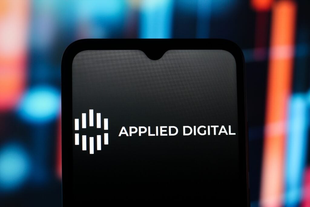 The Applied Digital Corp. logo is seen displayed on a smartphone screen