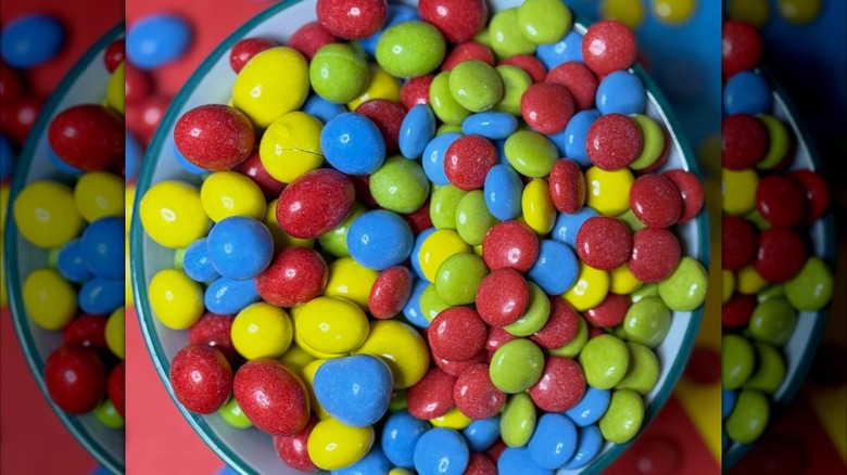 Multi-colored Mummy Meegz M'z Gems arranged in a small bowl, overhead view