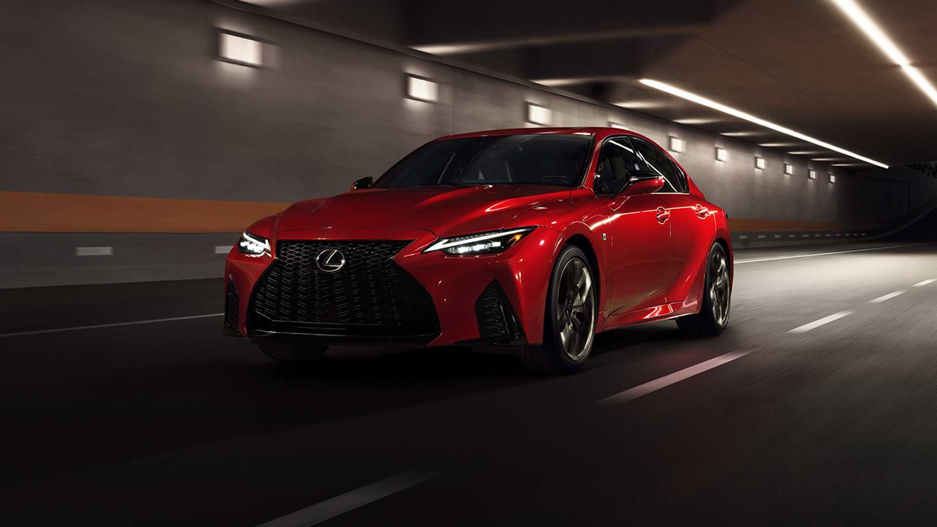 Red 2024 Lexus IS500 F Sport front shot driving through tunnel