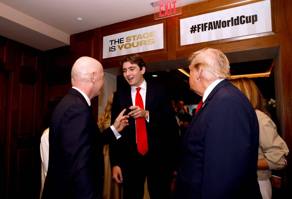 Barron Trump, U.S. President Donald Trump, and FIFA President Gianni Infantino attend the FIFA World Cup 2026