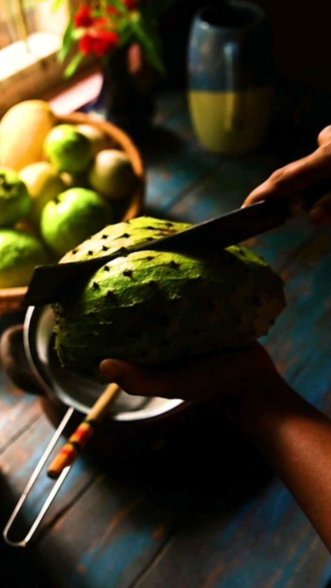 Making a layered soursop and guava fruit pudding
