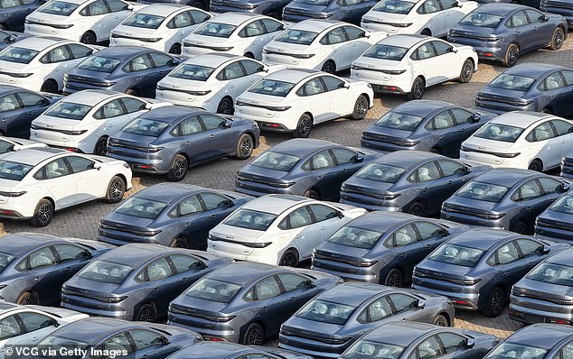 Aerial view of BYD Seal 06 electric vehicles waiting to be loaded onto ships for export at Yantai Port on July 19, 2026 in Yantai, Shandong Province of China