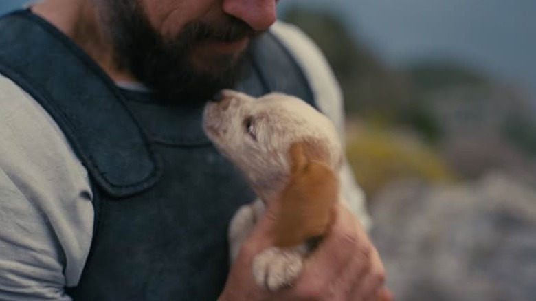 Puppy Argos in Odysseus' arms in The Odyssey