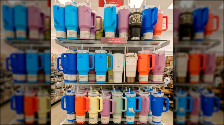 Shelves of Stanley tumblers at a HomeGoods store.