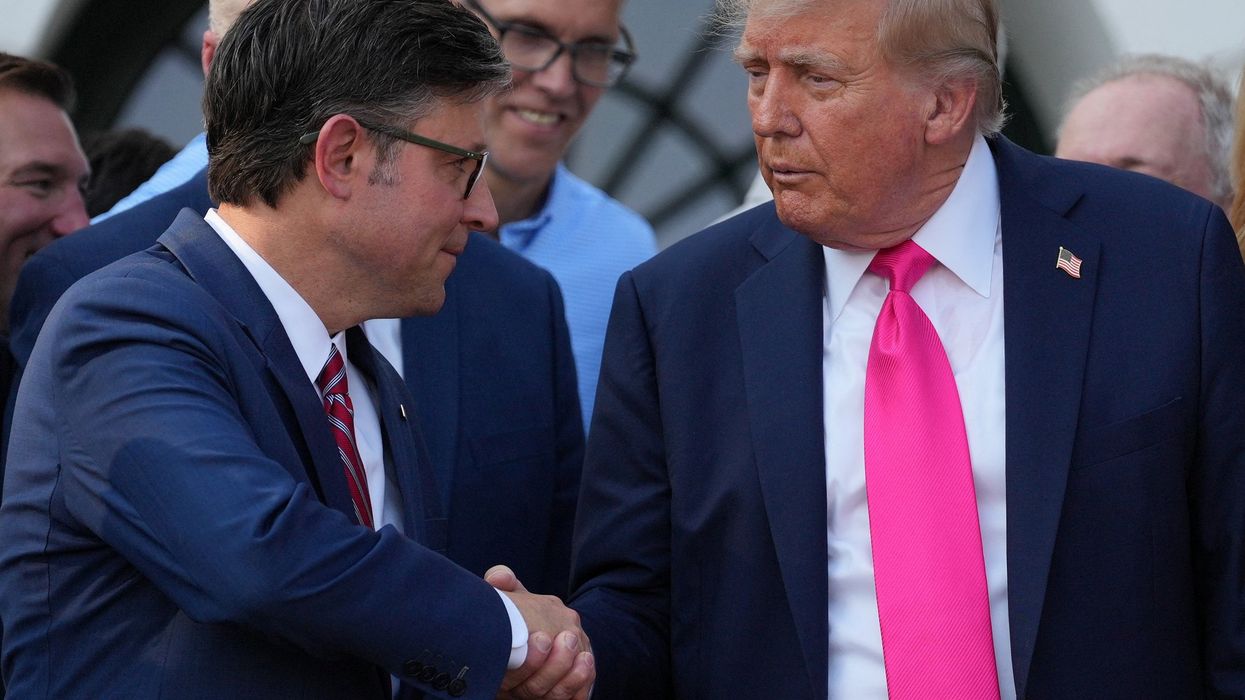 House Speaker Mike Johnson shakes hands with President Donald Trump at the White House in Washington, D.C., July 4, 2025. REUTERS/Leah Millis