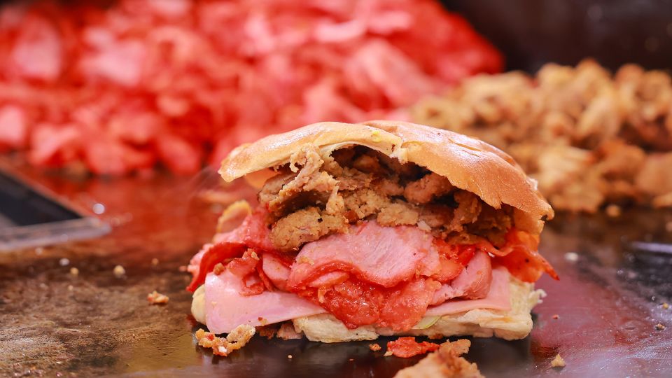 A traditional torta is prepared on a hot griddle during Mexico's