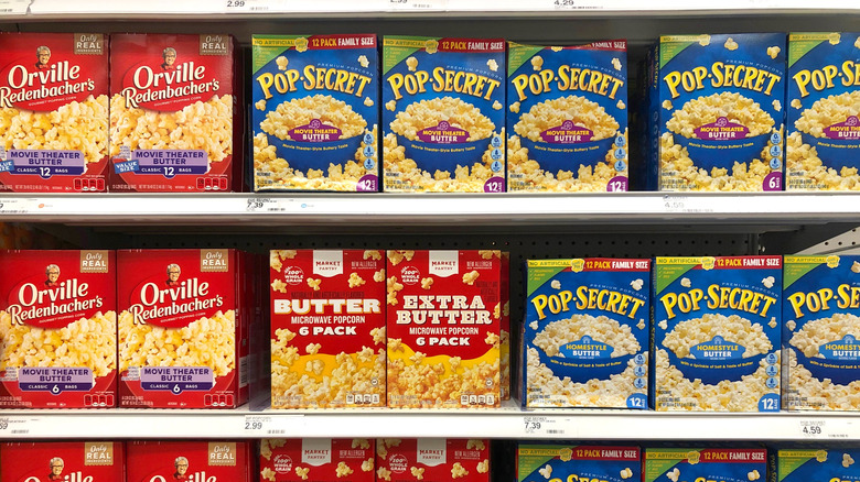 Boxes of microwave popcorn on shelves