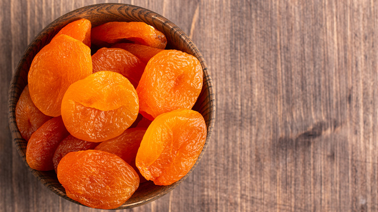 A bowl of dried apricots
