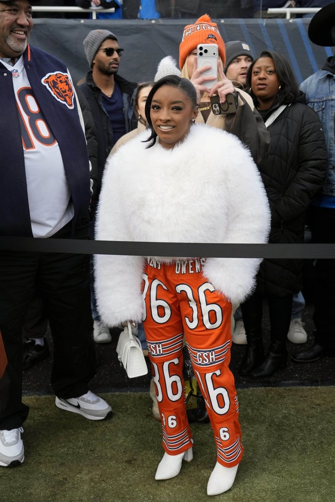 Jan 4, 2026; Chicago, Illinois, USA; Gymnast and gold medalist Simone Biles looks on from the sideilne before the game between the Chicago Bears and the Detroit Lions at Soldier Field. Mandatory Credit: David Banks-Imagn Images