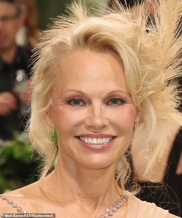 With mascara: Pamela Anderson has long been associated with the 'blonde bombshell' aesthetic thanks to her glam looks throughout the 90s, noughties and 2010s
