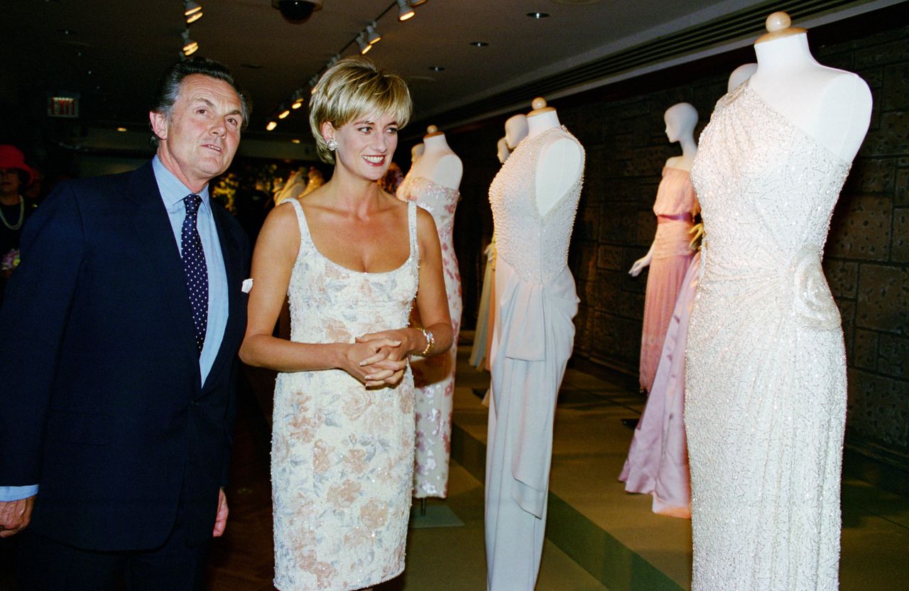 Princess Diana with Lord Hindlip viewing items that she put up for auction at Christie's.