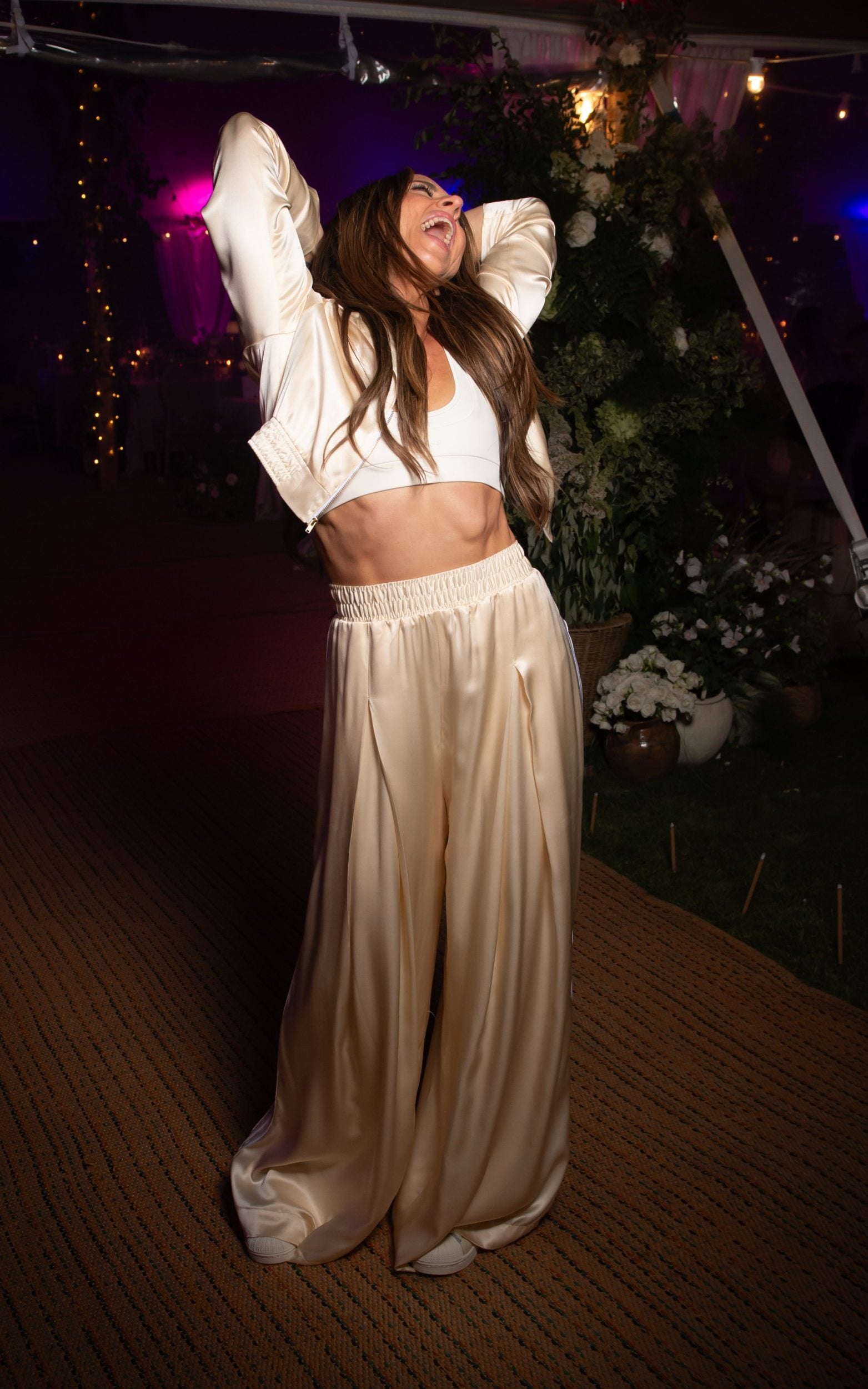 Mel C changed into a bespoke ivory silk Adidas tracksuit for the reception – a bridal take on Sporty Spice's signature look