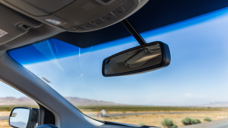 Why do some windshields have a blue tint at the top?