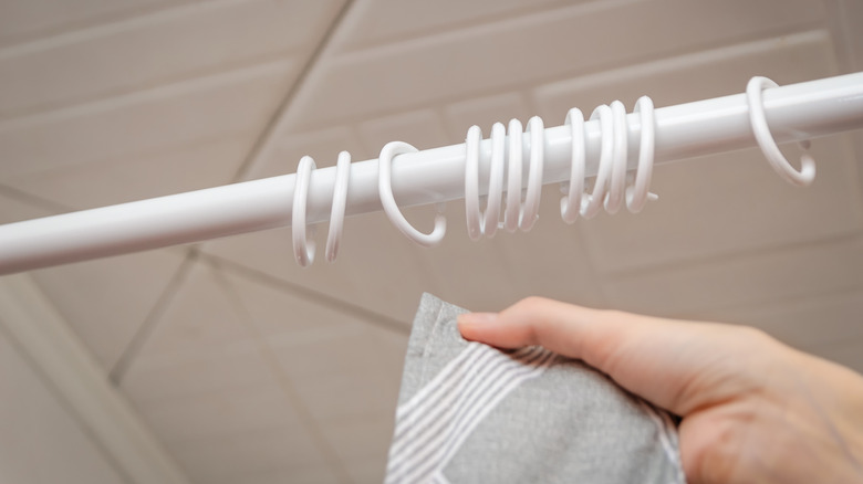 Turn shower curtain rings into a high-end wall feature with a chic Dollar Tree DIY