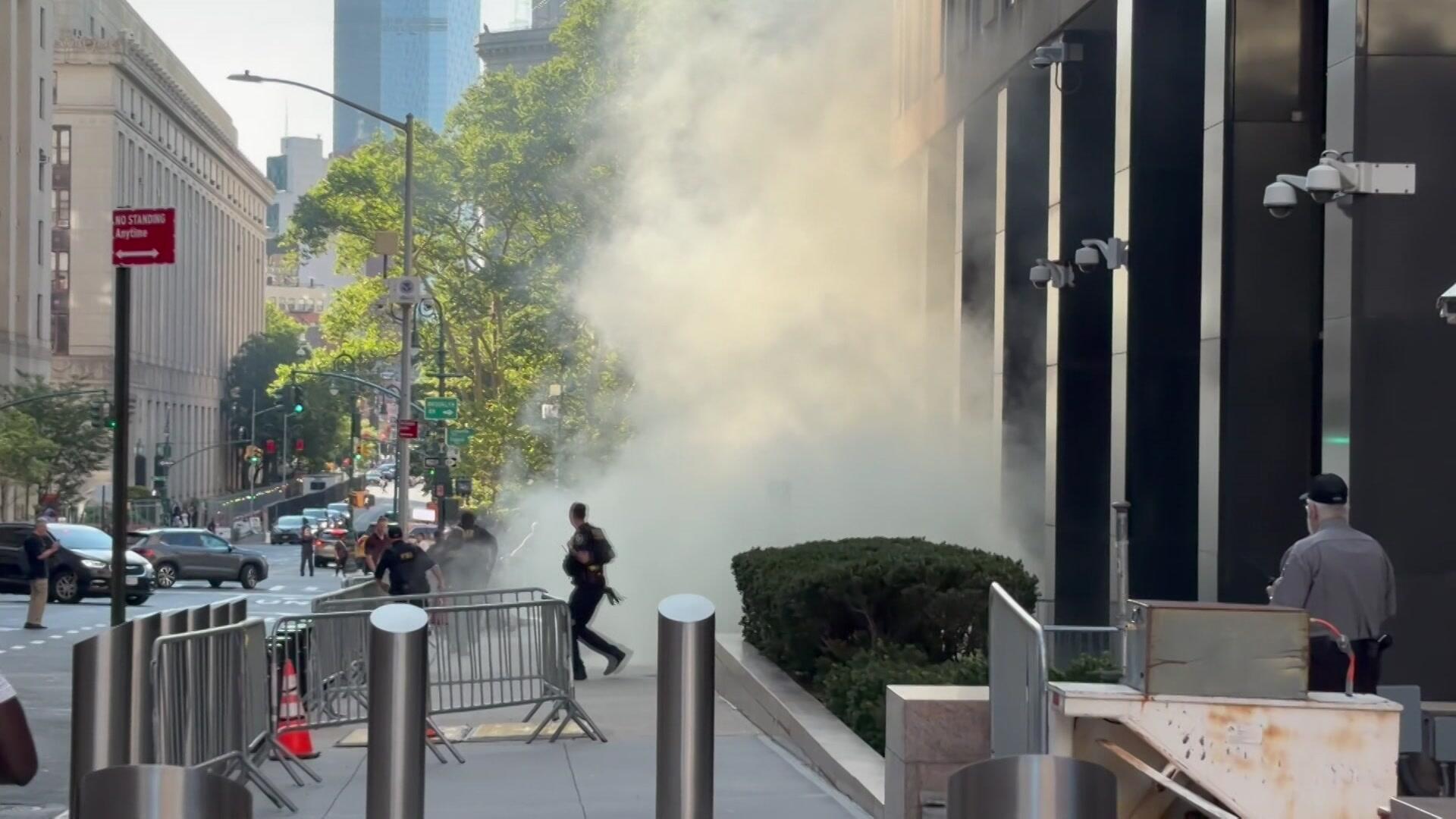 Heavy smoke was seen outside 26 Federal Plaza after an explosion caused by fireworks, sources said. / Credit: CBS News New York