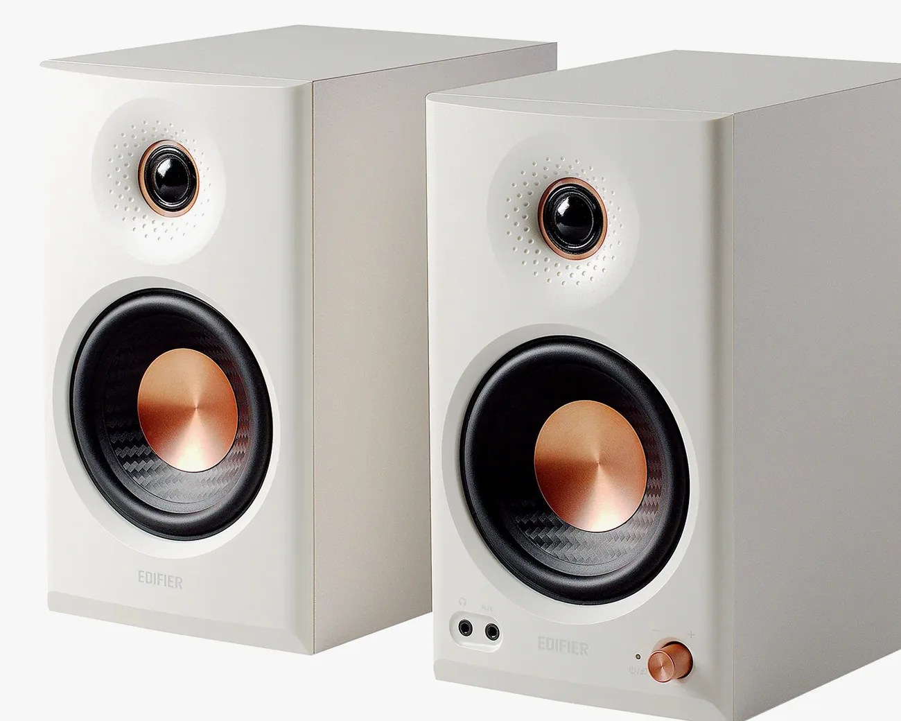 Pair of white Edifier bookshelf speakers with copper-accented drivers and control knob.