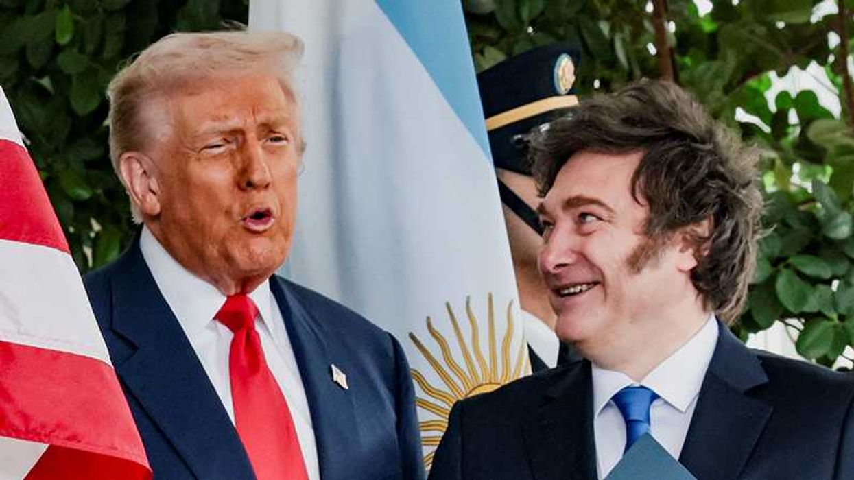U.S. President Donald Trump and Argentina's President Javier Milei react at the White House in Washington, D.C., U.S., October 14, 2025. REUTERS/Jonathan Ernst