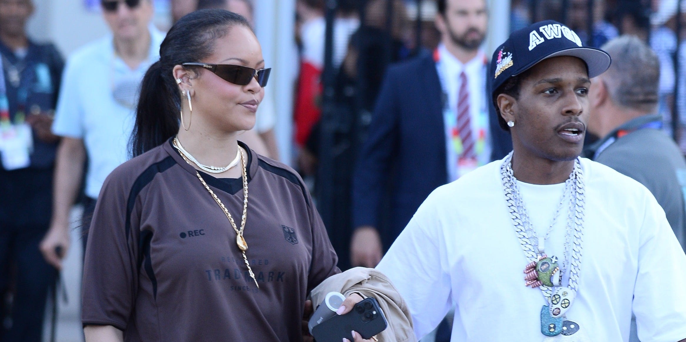 The summer heat won’t stop Rihanna from wearing her knee-high suede boots