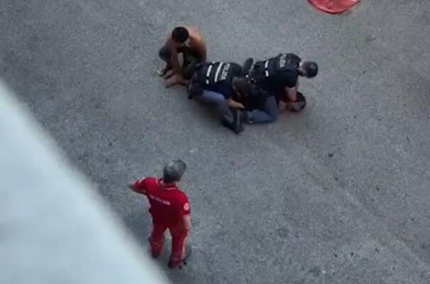 A screengrab from amateur video shared widely on social media, including by the family of Moroccan-born Italian Abderrahim Fakir, shows him being held down by two police officers and a third man on July 19, 2026, in Bologna, Italy, during an attempted arrest that ended with his death. / Credit: Social media