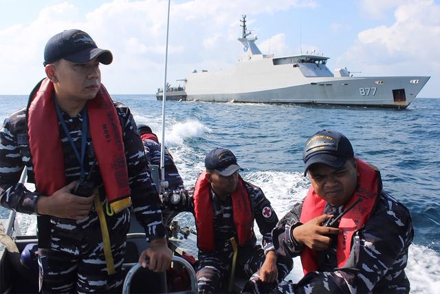 In this photo released by Makassar Search and Rescue Office on Sunday, July 19, 2026, Indonesian Navy personnel cruises on a rubber boat during a search for victims after a passenger boat sank in the waters near Balaloho Island in South Sulawesi, Indonesia.