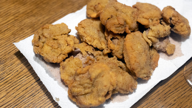 Fried calf fries on a paper towel