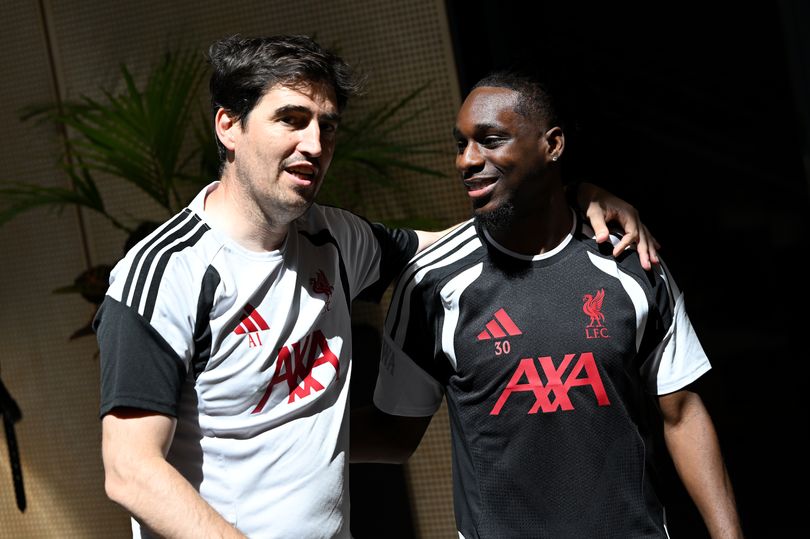 Andoni Iraola and Jeremie Frimpong emerge for a Liverpool training session.