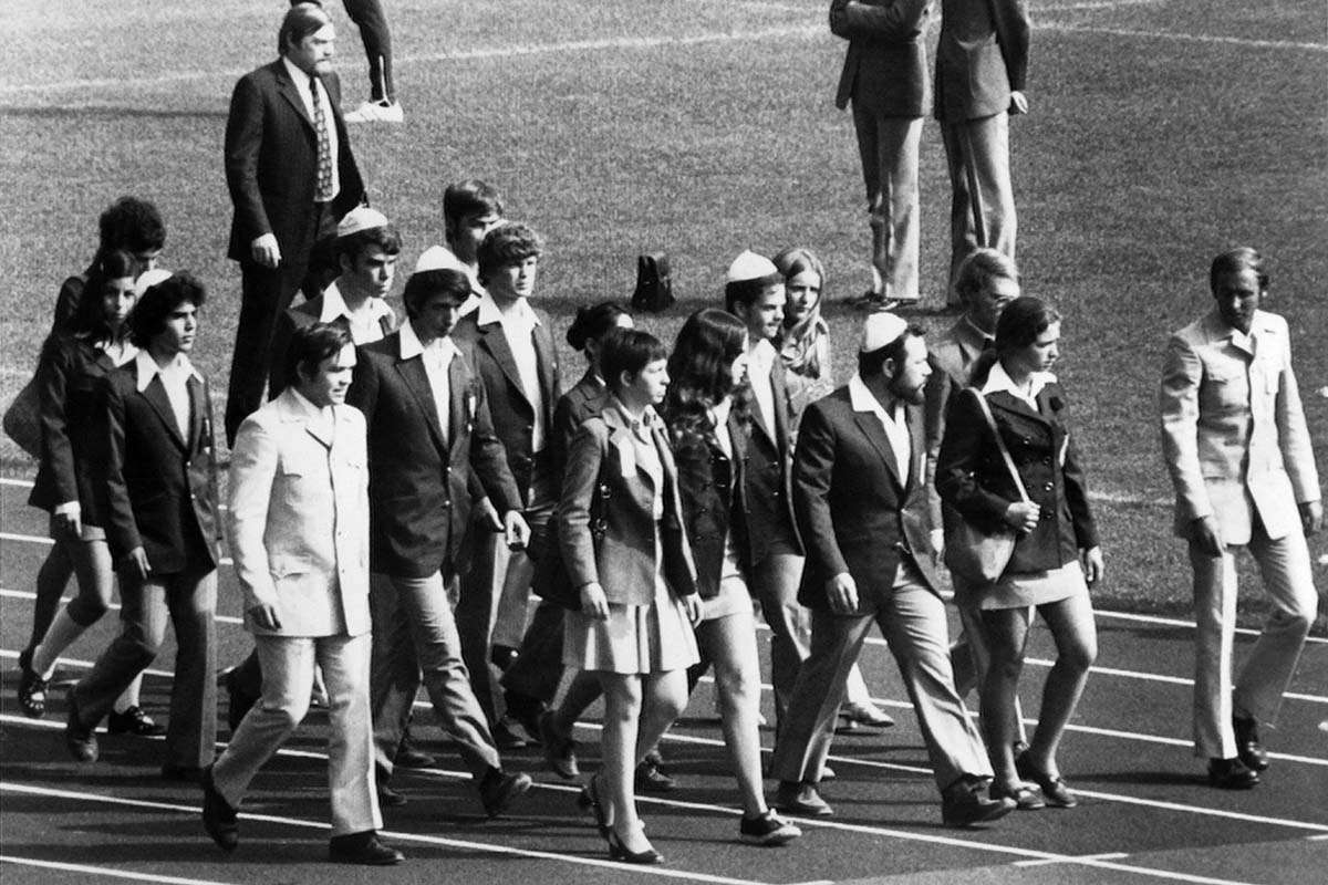 Members of the Israeli team march on the field of the Munich Olympic stadium on September 6, 1972, to attend the memorial ceremony paying tribute to their countrymen that a commando of Palestinian militants killed. (EPU/AFP via Getty Images)
