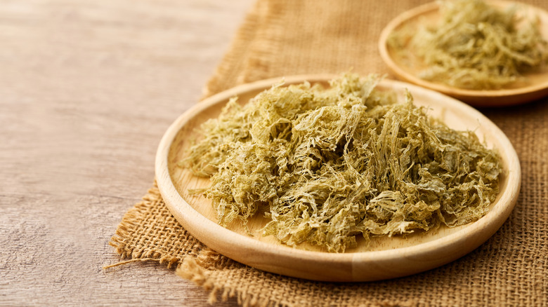 A closeup of furikake on a wooden plate