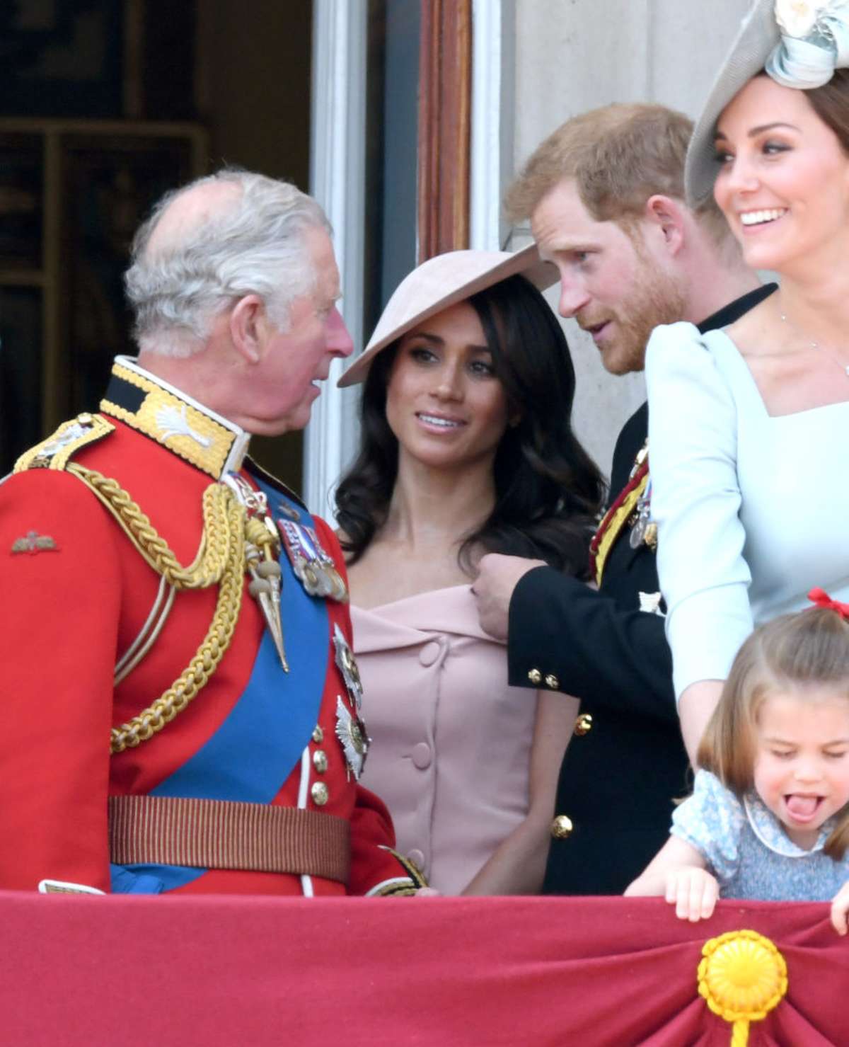 King Charles, Meghan Markle, and Prince Harry having a conversation on the balcony of Buckingham Palace during the 2018 Trooping the Colour (Image Source: Getty Images I Karwai Tang/WireImage)
