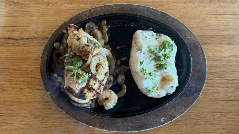 Applebee's Bourbon Street Chicken and Shrimp on cast iron skillet.