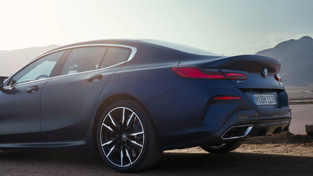 2026-bmw-8-series-gran-coupe-m850i-xdrive-in-blue-rear-angled-view-closeup