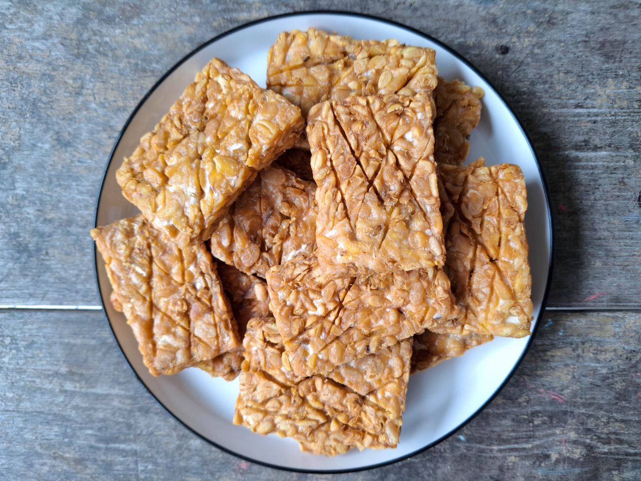 A plate with sliced tempeh blocks
