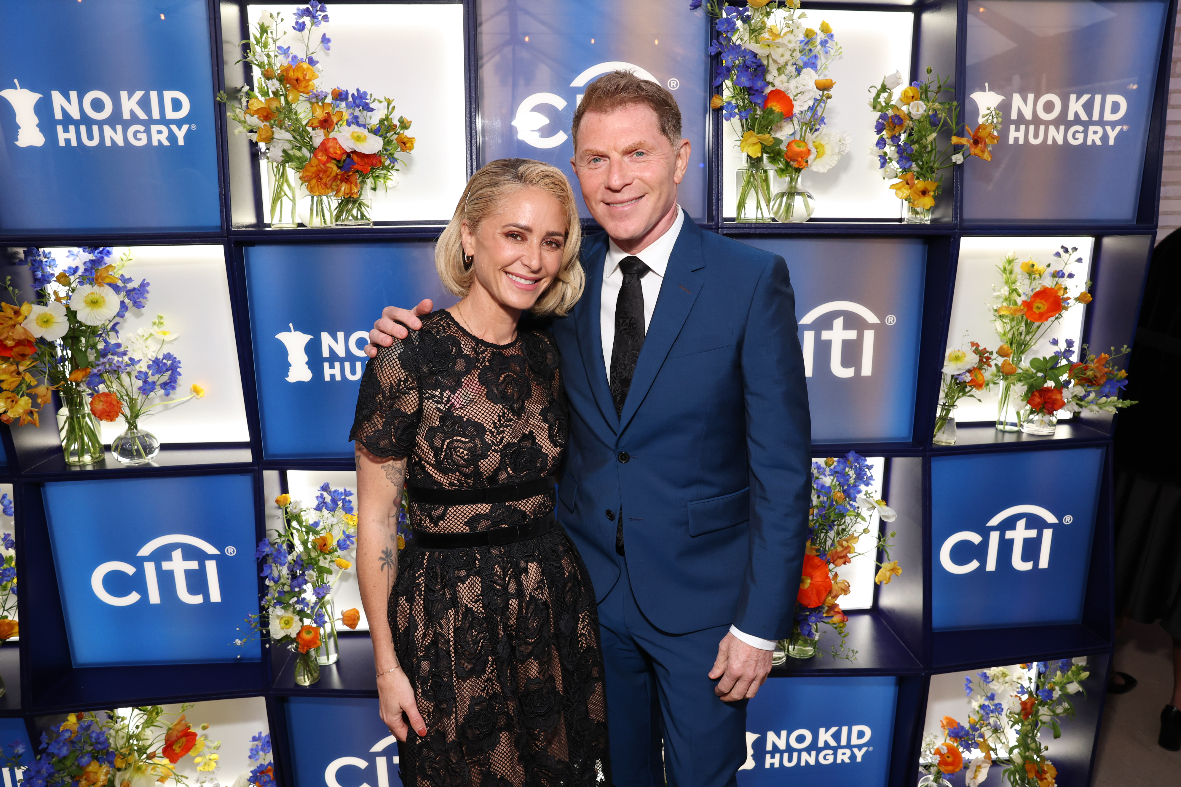 Brooke Williamson and Bobby Flay pose together at the 2025 No Kid Hungry Los Angeles Dinner.