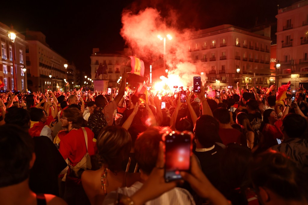 MADRID, SPAIN - JULY 20: Spanish fans celebrate Spain's win at the FIFA World Cup 2026 final match between Spain and Argentina on July 20, 2026 in Madrid, Spain. Spain defeated reigning World Cup champions Argentina 1-0, with the lone goal coming from Ferran Torres #7 in the 106th minute of extra time. (Photo by Chris McGrath/Getty Images)