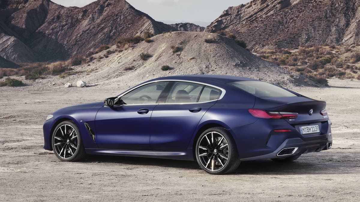 2023-bmw-8-series-gran-coupe-m850i-xdrive-in-blue-rear-angled-view
