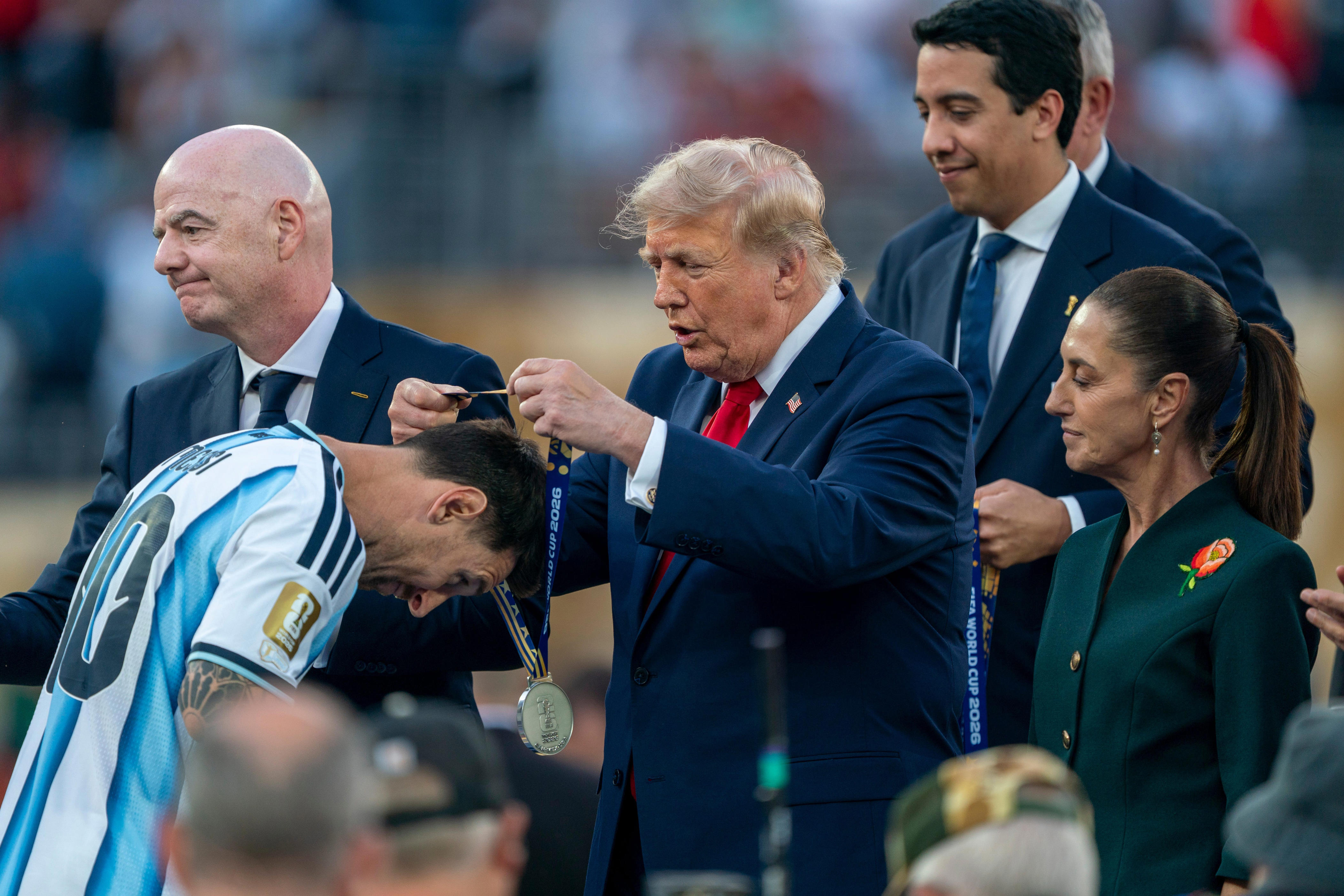 President Donald Trump places a medal on Argentina forward Lionel Messi (10) following Spain’s victory over Argentina during the 2026 FIFA World Cup on July 19.