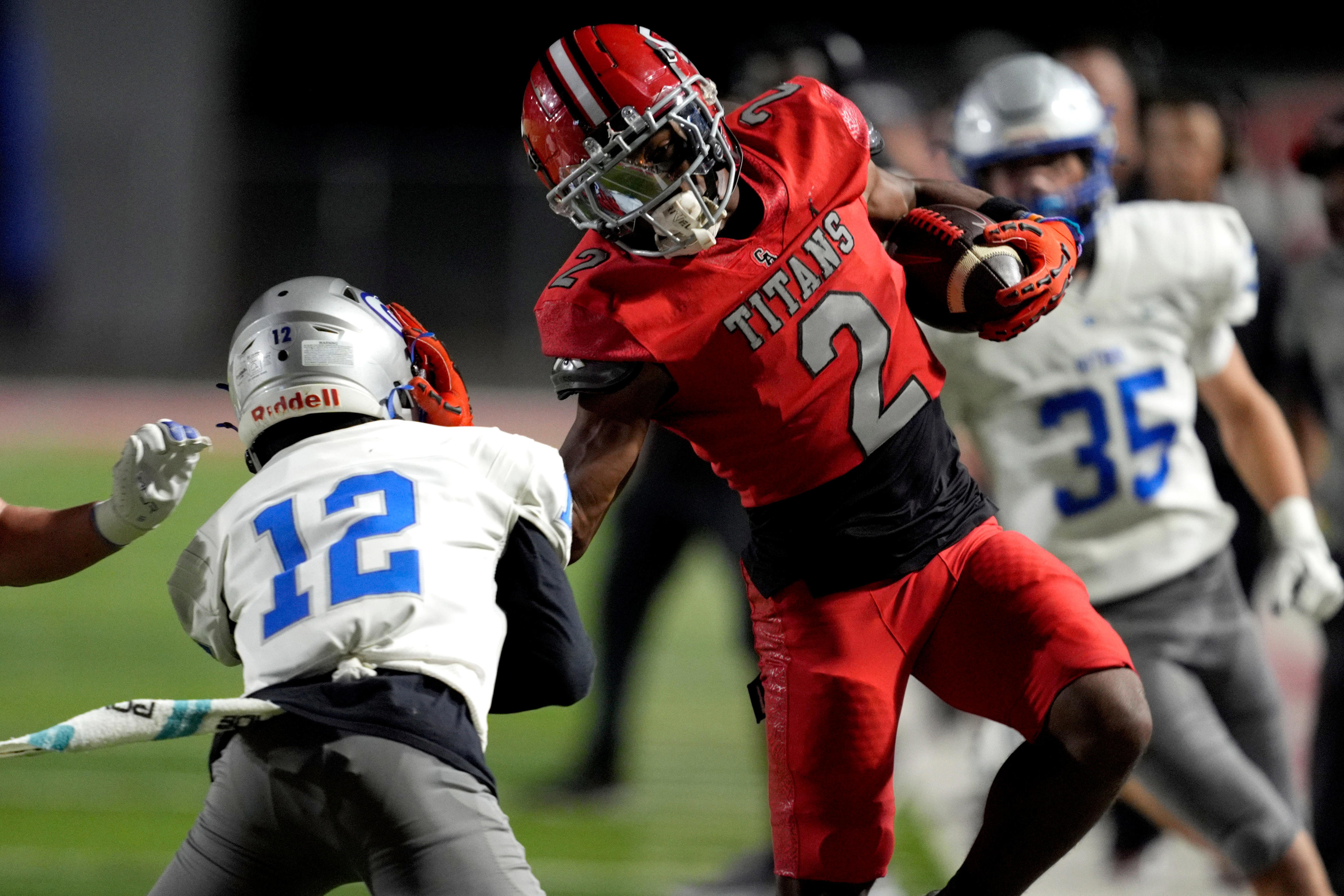 Carl Albert's Jacson Webster is pushed out by Guthrie's Dereon Whitehorn during a high school football game between Carl Albert and Guthrie in Midwest City, Okla., Friday, Oct. 31, 2025.