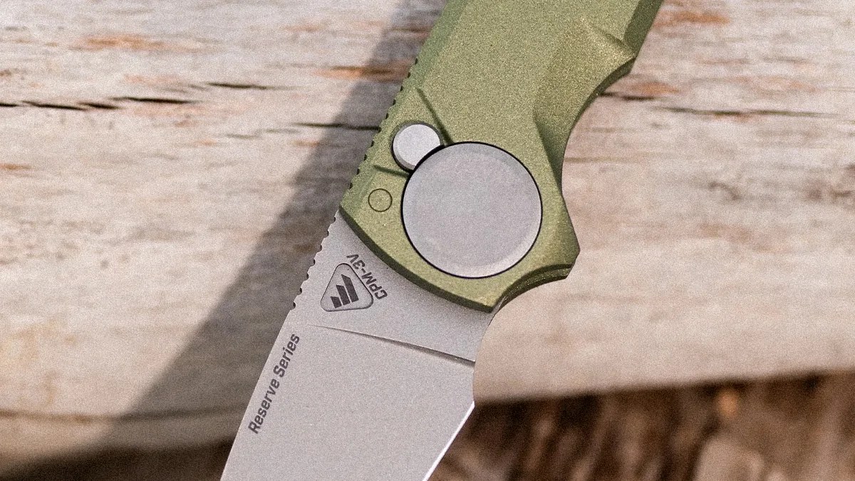 Close-up of a folding knife blade marked 