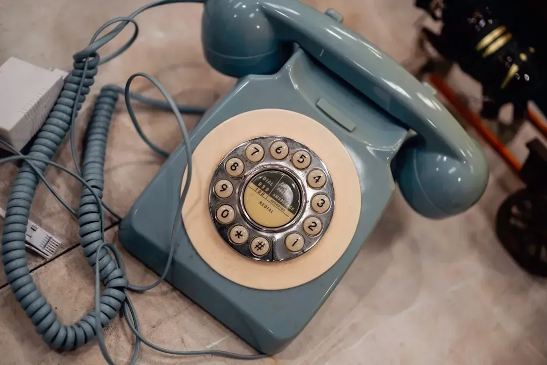 1. The Corded Phone Bolted to the Kitchen Wall (Image Credits: Unsplash)