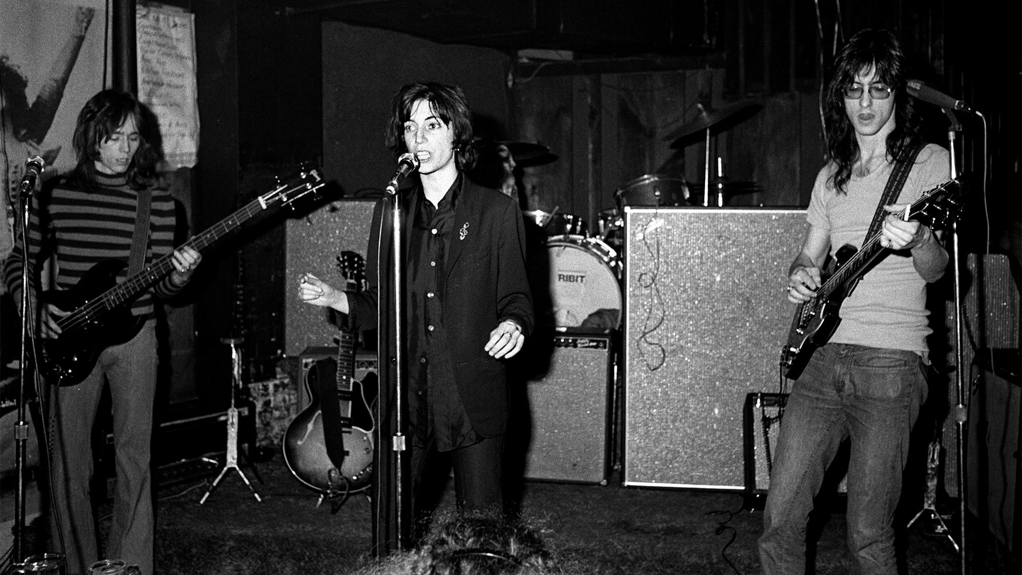Patti Smith performing with Lenny Kaye (right) and Ivan Kral (left) from the Patti Smith Group at CBGB's club in New York City on April 04 1975
