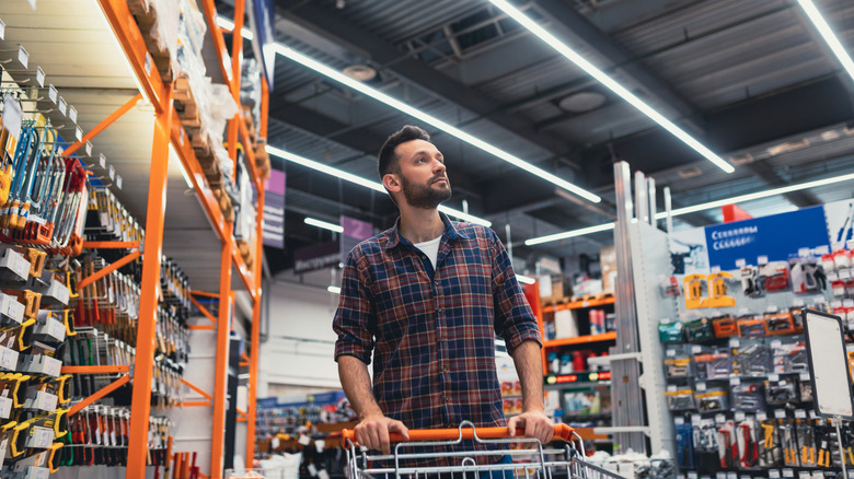 Person shopping for tools in a hardware store