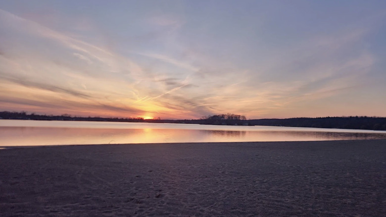 beautiful sunset over Pontiac Lake beach in Pontia Lake Recreation Area, Michigan