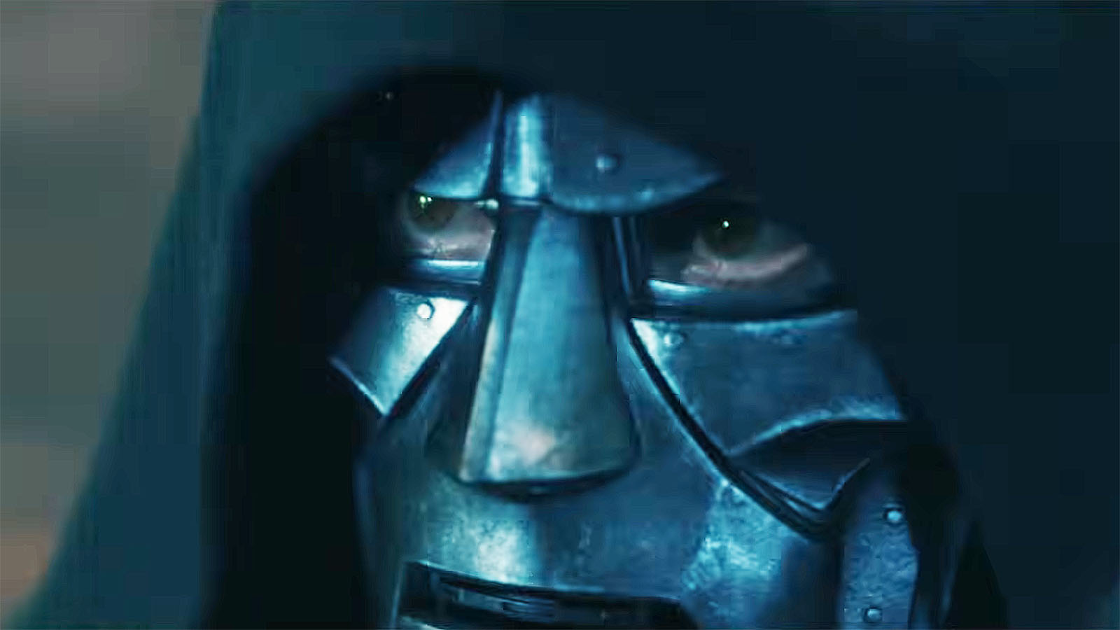 A close up of Robert Downey Jr's Doctor Doom with his hood up and wearing his metal mask in Avengers: Doomsday