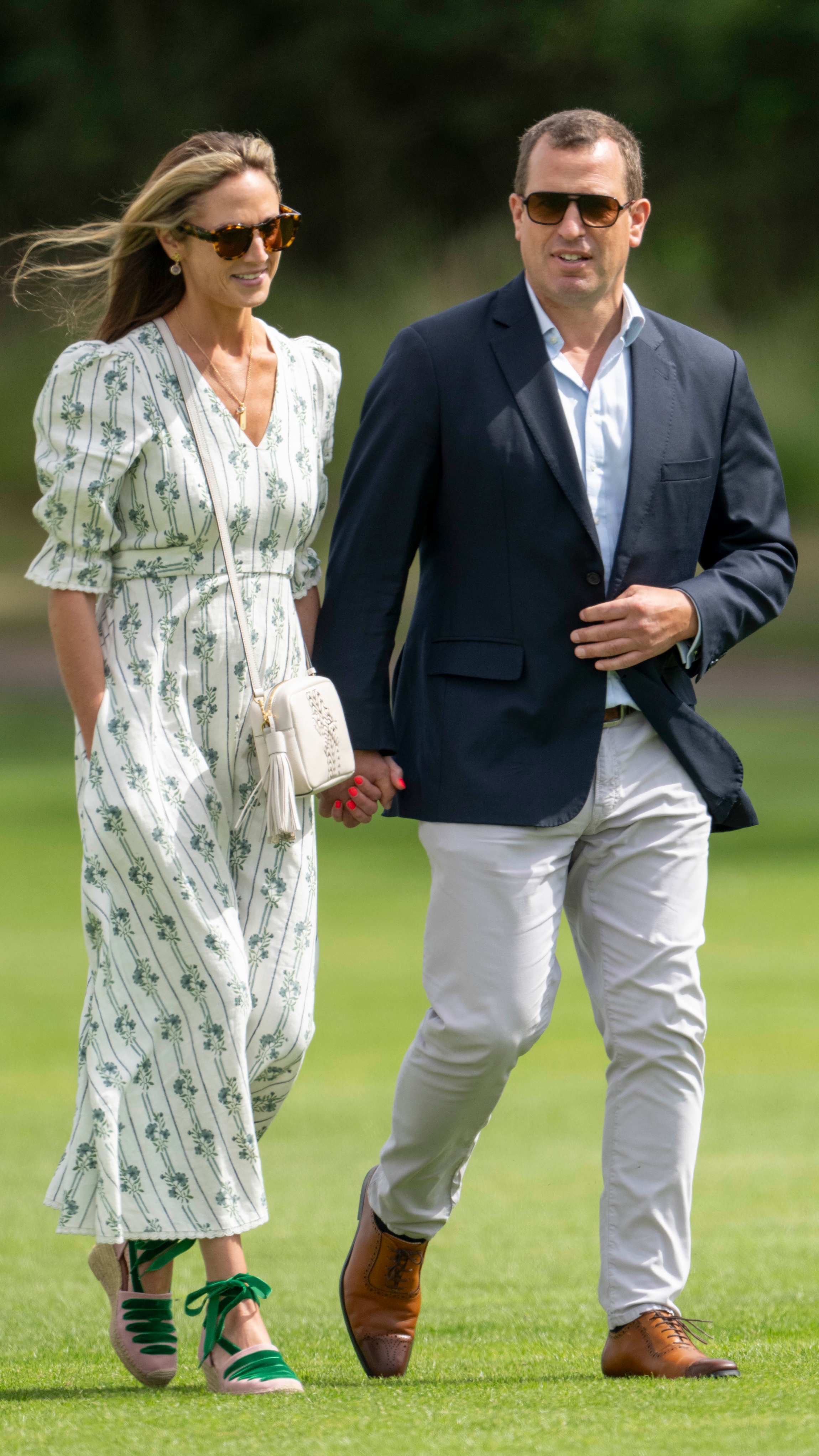 Peter Phillips and Harriet Sperling during the Royal Charity Polo match at Castle Ground on July 12, 2024 in Windsor