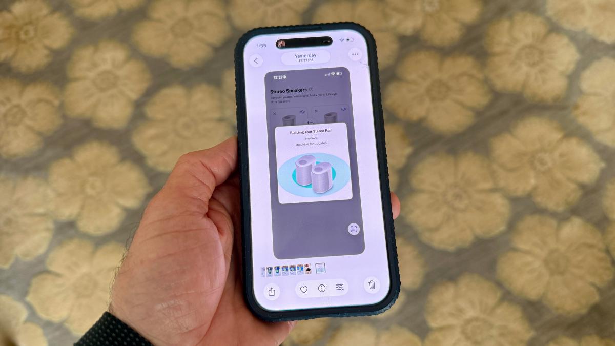 A phone in a hand showing the pairing process for the Bose Lifestyle Speaker in the Bose mobile app.