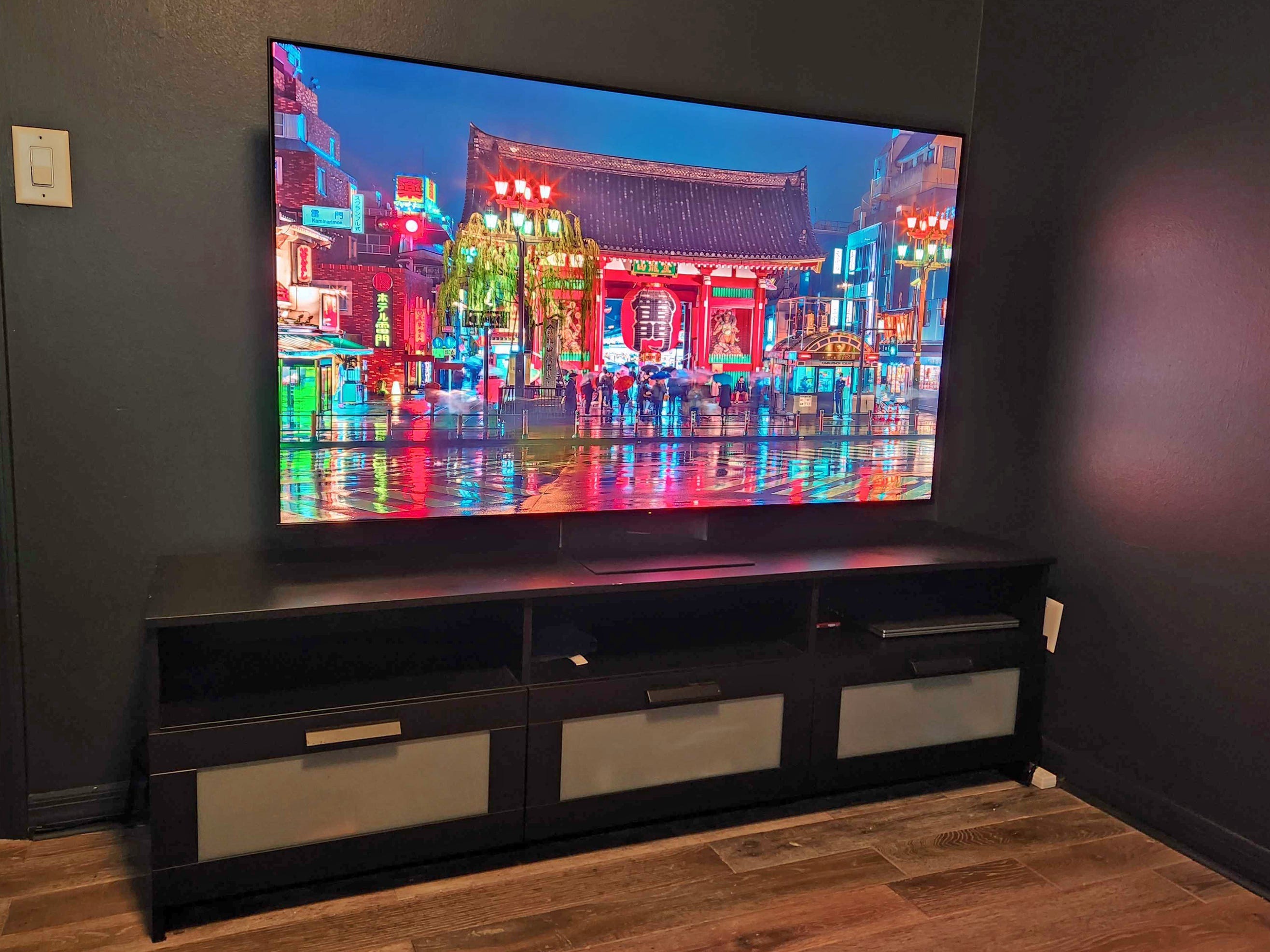 An angled view of a Sony Bravia 7 II True RGB TV on our reviewer's media console in their home office.