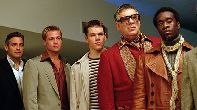 Matt Damon and Brad Pitt appear in a scene from the 2001 film ‘Oceans 11’ with cast members George Clooney, Don Cheadle, and Elliott Gould. / 2001 - Warner Bros