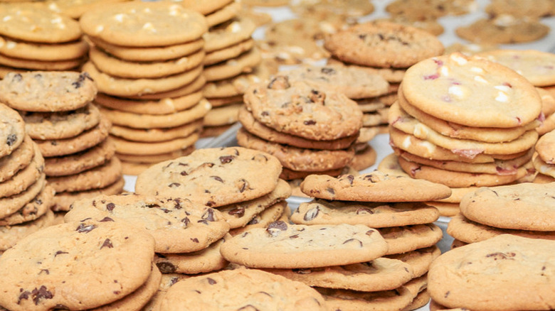 Numerous piles of Subway cookies stacked together