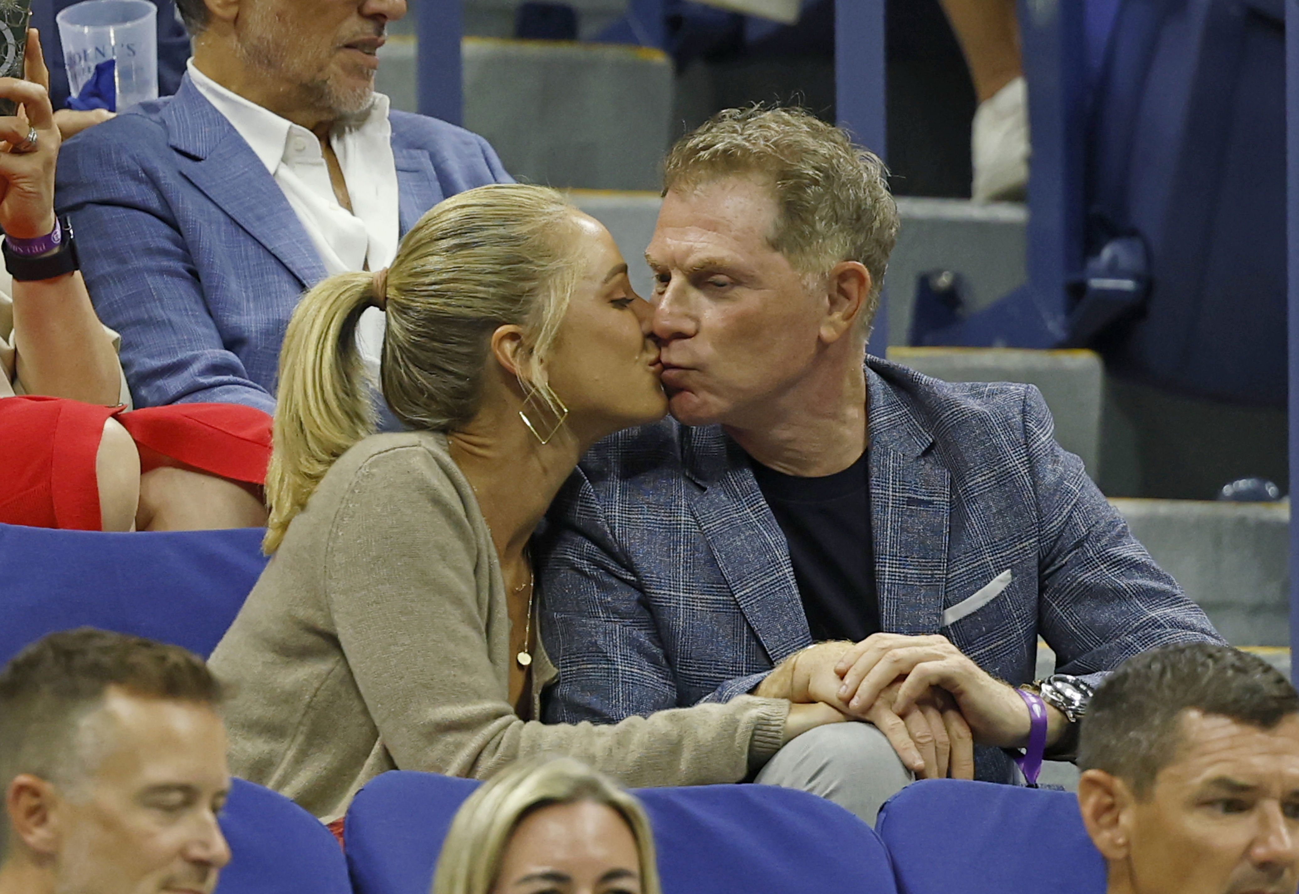 Bobby Flay kissing Brooke Williamson at the US Open Tennis Championships.