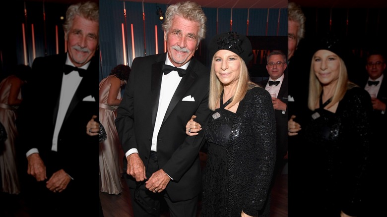 Barbra Streisand wearing a sparkly black outfit and hat arm-in-arm with husband James Brolin in a tux.